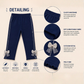 Navy blue pants with bow details on a beige background, featuring text on detailing.